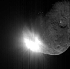 The growing fireball and beginning of ejection of material from within the forming crater.