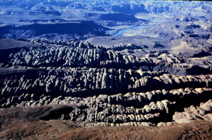 Joints in a sandstone unit, which are widened by water erosion; Henry Mountains, Utah.