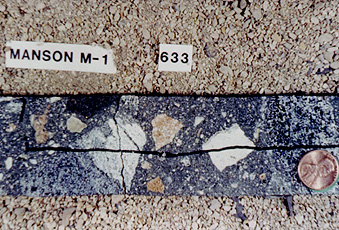 Core segment from drill hole into central peak of the Manson (Iowa) impact structure, showing breccias of impact origin.