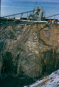Strongly deformed limestone beds seen along a quarry face at the Kentland, IN structure.